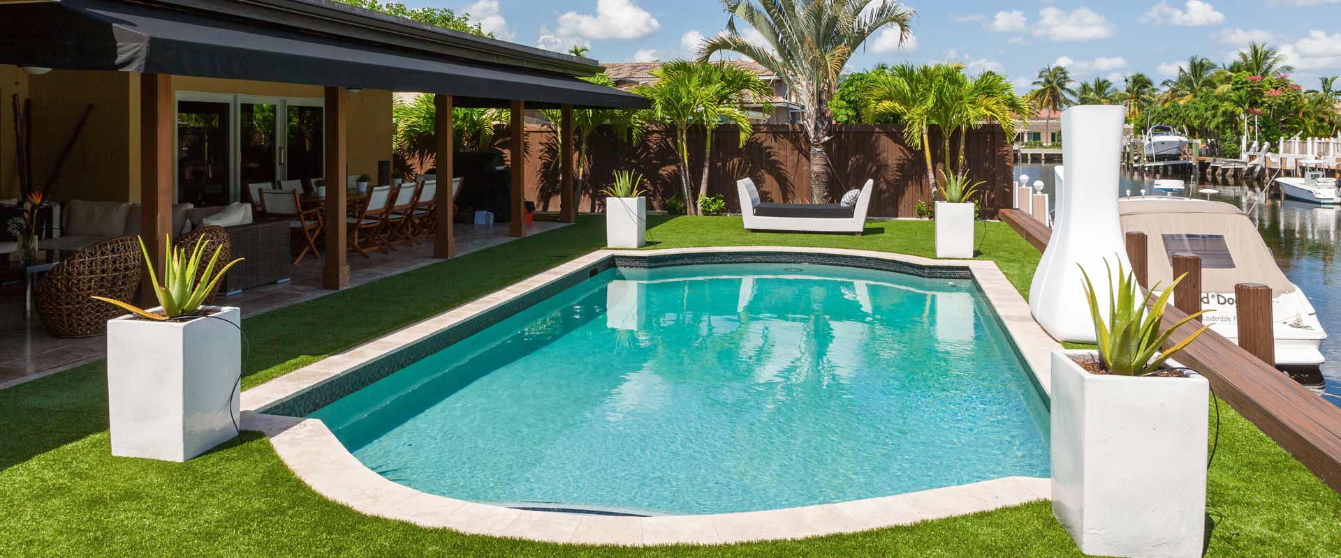 Artificial grass pool surround installed by Top Turf